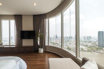 Modern bedroom with large windows and city view