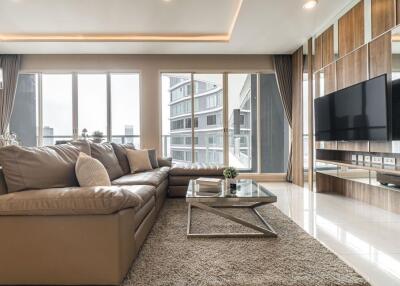 Modern living room with large windows and city view