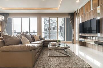 Modern living room with large windows and city view