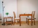 Small dining area with wooden table and chairs