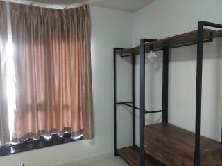 Bedroom with window and shelf