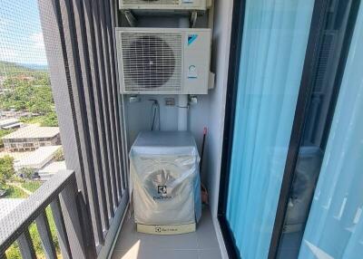 Balcony with washing machine and air conditioning units