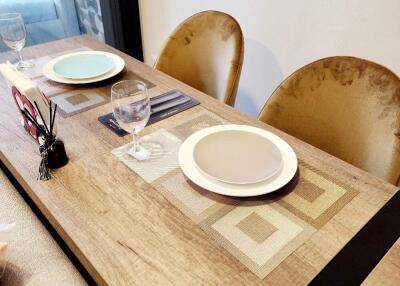 Dining table set with plates and glasses