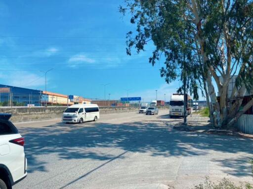 View of a city street with vehicles and buildings