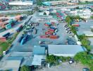 Aerial view of an industrial area with shipping containers and trucks