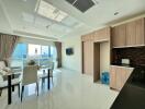 Modern living room and kitchen with city view