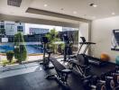 Well-equipped gym overlooking the pool