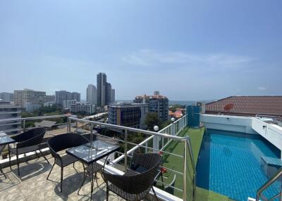 Rooftop view with seating area and pool