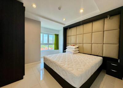modern bedroom with large window and ample natural light