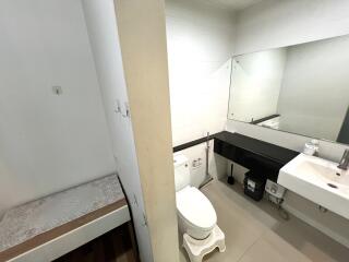 Modern bathroom with large mirror and black countertop