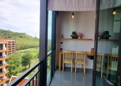 View of a balcony with seating area and scenic view