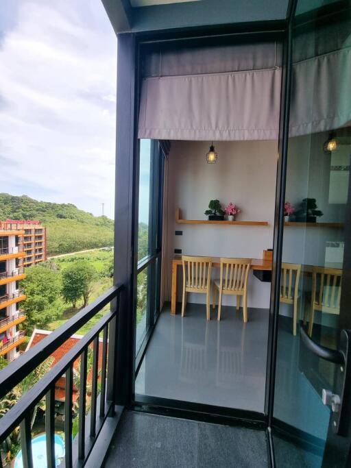 View of a balcony with seating area and scenic view