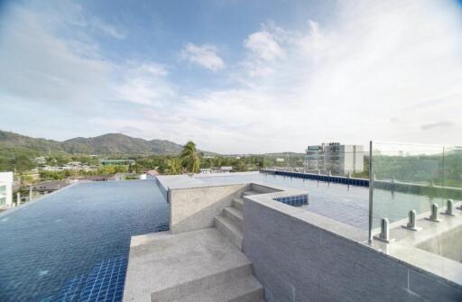 Rooftop infinity pool with scenic mountain views