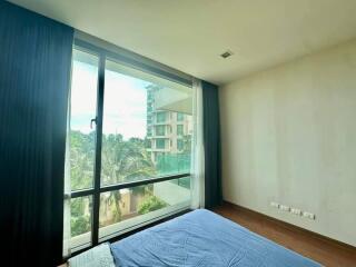 Modern bedroom with large window and a view