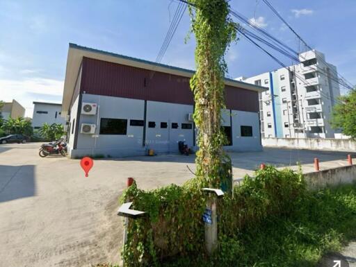 Exterior view of the building with parking area