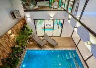 Modern courtyard with pool and lounging area