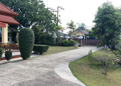 Front yard with garden and pathway leading to entrance