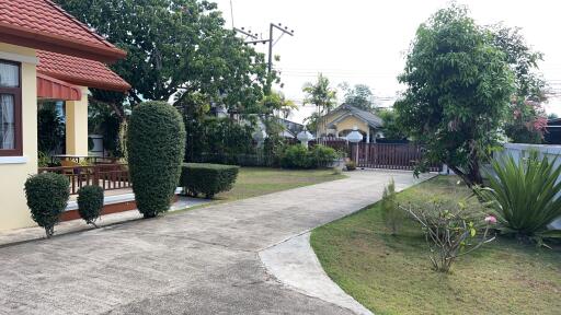 Front yard with garden and pathway leading to entrance