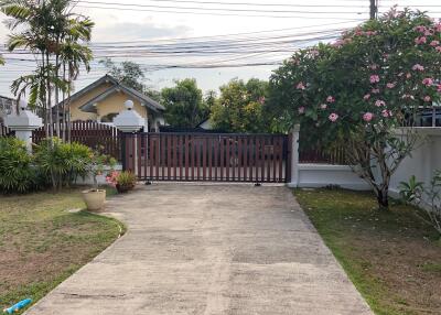 Gated driveway with garden