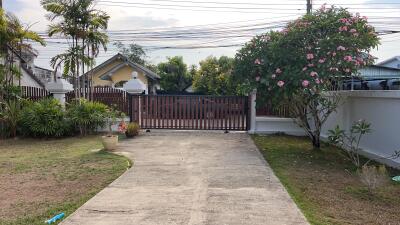 Gated driveway with garden