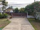 Gated driveway with garden