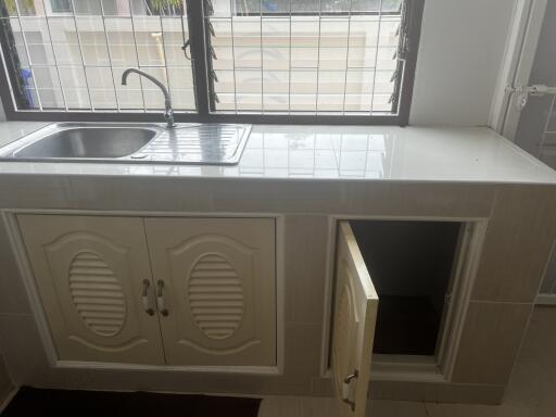 Kitchen with sink and cabinets