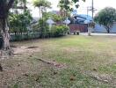 Spacious garden area with lawn and trees