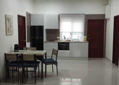 Modern kitchen and dining area with appliances