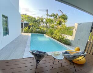 Outdoor area with swimming pool and seating