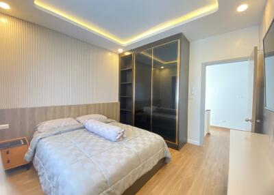 Modern bedroom with bed, wardrobe and nightstand