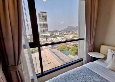 Bedroom with city and mountain view