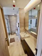 Modern bathroom with vanity mirror and glass shower enclosure