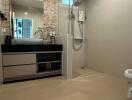 Modern bathroom with shower, sink, and countertop