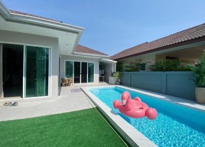 Modern backyard with swimming pool and inflatable float