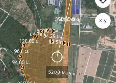 Aerial view of a land plot marked with coordinates