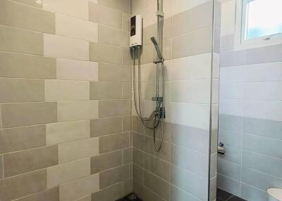 Modern bathroom with a tiled shower area