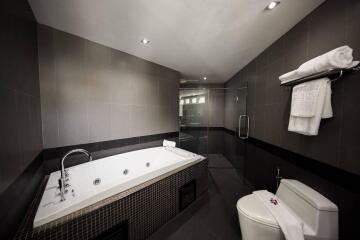 Modern bathroom with jacuzzi tub and shower