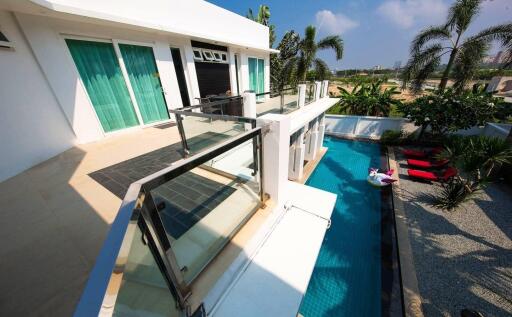 Modern building exterior with pool and patio area