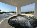 Outdoor terrace with jacuzzi and scenic view