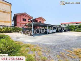 Covered parking area in front of residential buildings