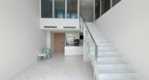 Living room with staircase, modern decor, open concept