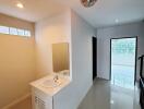 Modern hallway with a sink and large windows