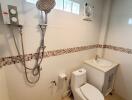 Modern bathroom with shower, toilet, and sink