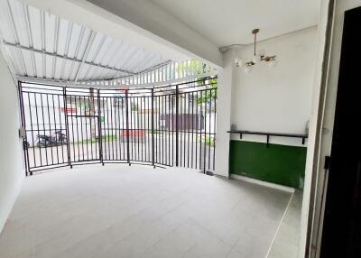 Covered garage with metal gate