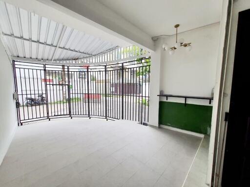 Covered garage with metal gate