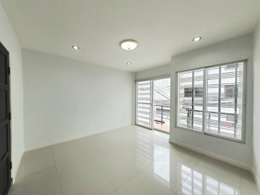 Spacious living room with large windows