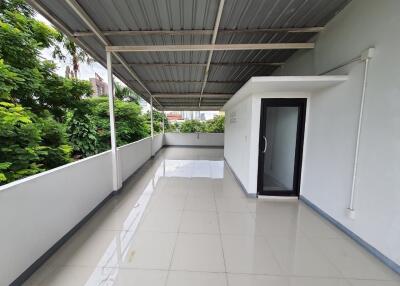 Spacious covered terrace with tiled floor