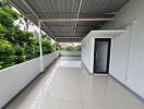 Spacious covered terrace with tiled floor