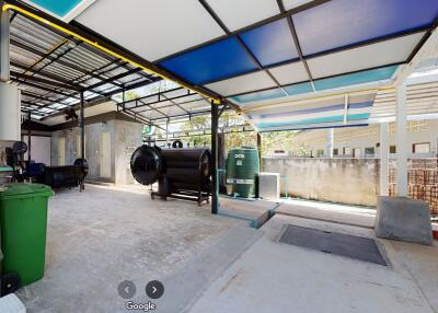 Outdoor area with tanks and covered roof