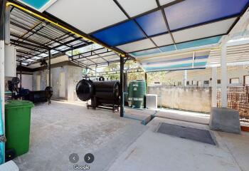 Outdoor area with tanks and covered roof